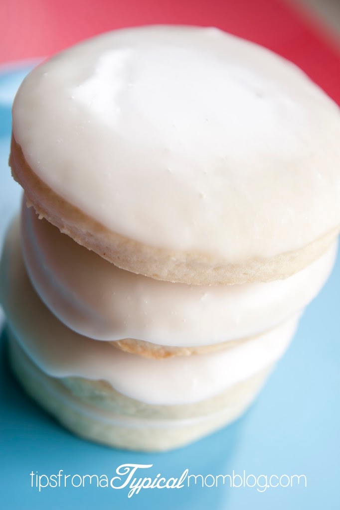 Kneaders Bakery Sugar Cookies Recipe with awesome Lemon Glaze! These are perfectly thick and fluffy Bakery Style Sugar Cookies and the glaze is perfect. From Tips From a Typical Mom.